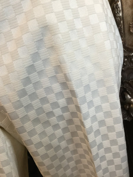 Ivory embossed pattern print pants