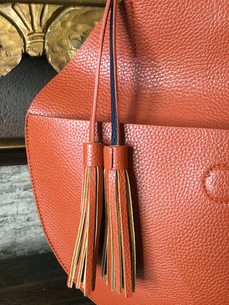 REMI/RIED rustic circle v leather handbag