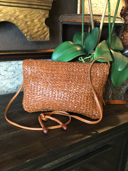 Woven brown leather handbag