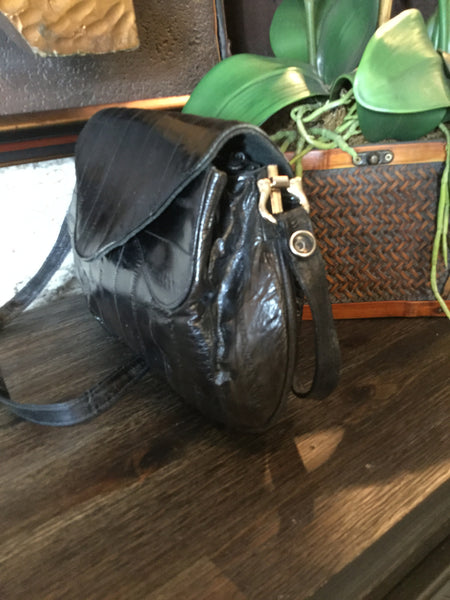 Vintage black metal trim eel skin handbag