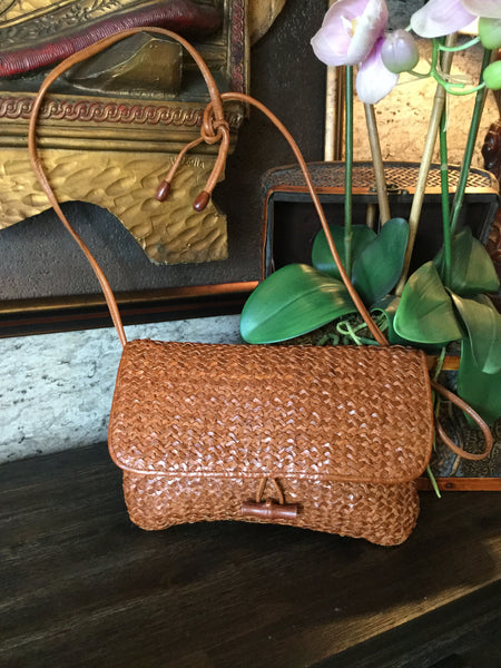 Woven brown leather handbag