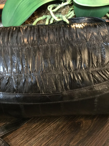 Black hard shell eel skin handbag