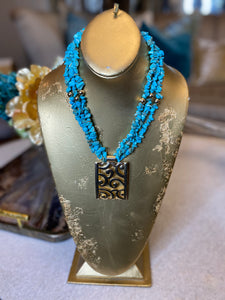 Turquoise chip multi strand gold medallion necklace