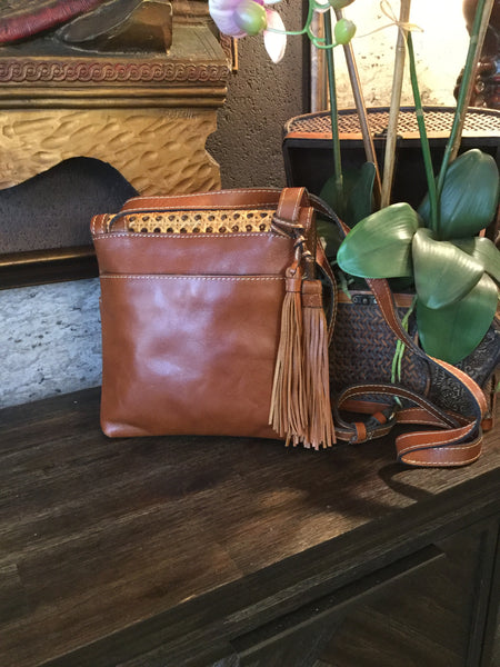 Leather cane trim crossbody handbag