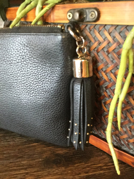 Black leather wristlet handbag